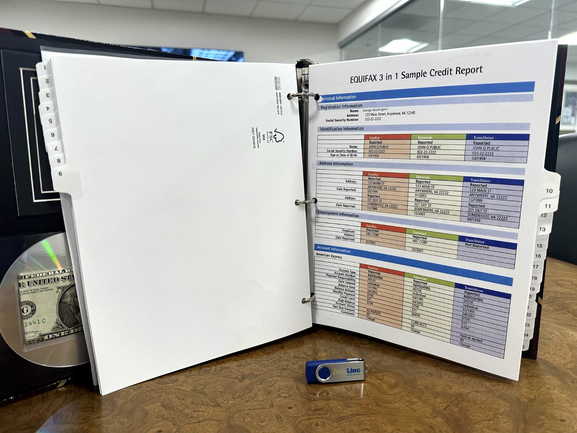 A Compendium binder open to a sample credit report section